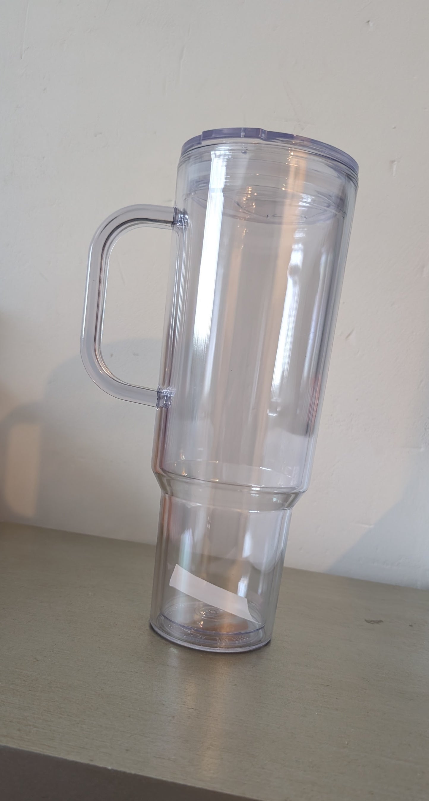 Plastic 40 oz Slow globe tumbler with handle and Straw.