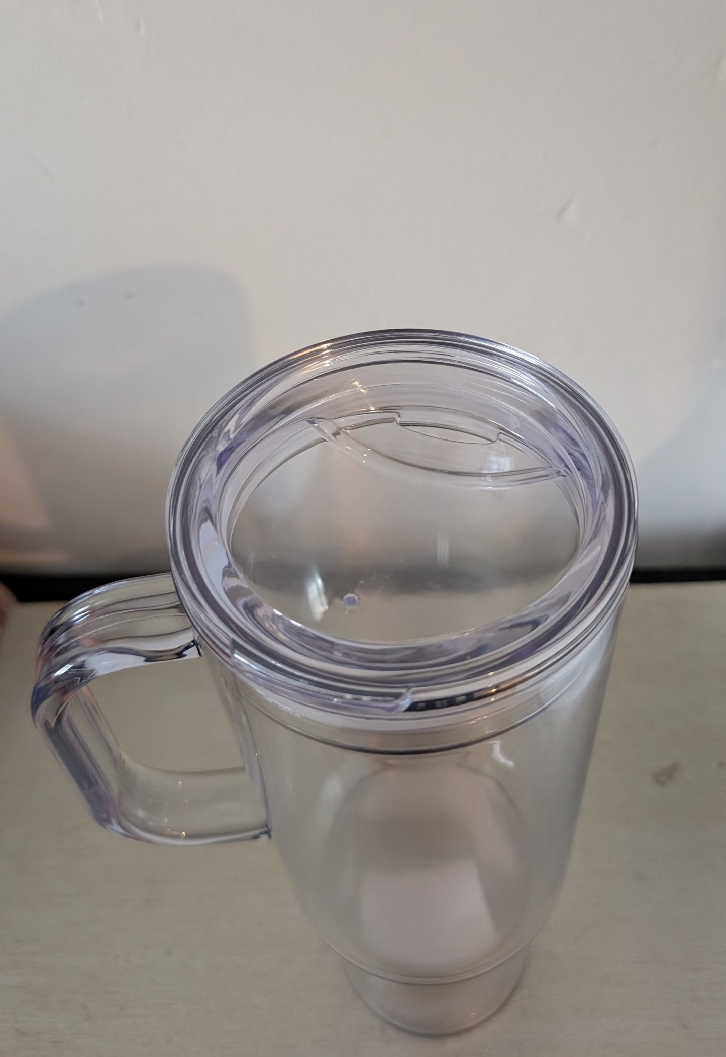 Plastic 40 oz Slow globe tumbler with handle and Straw.